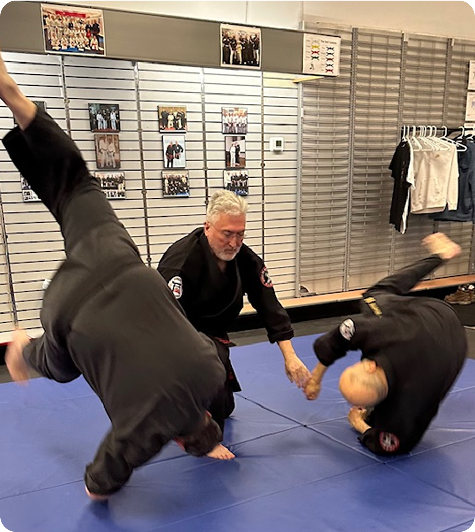 Instructor teaching martial arts to students