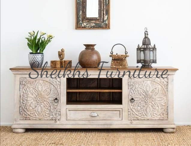 Eye-level view of a handcrafted rosewood bed showcasing intricate designs