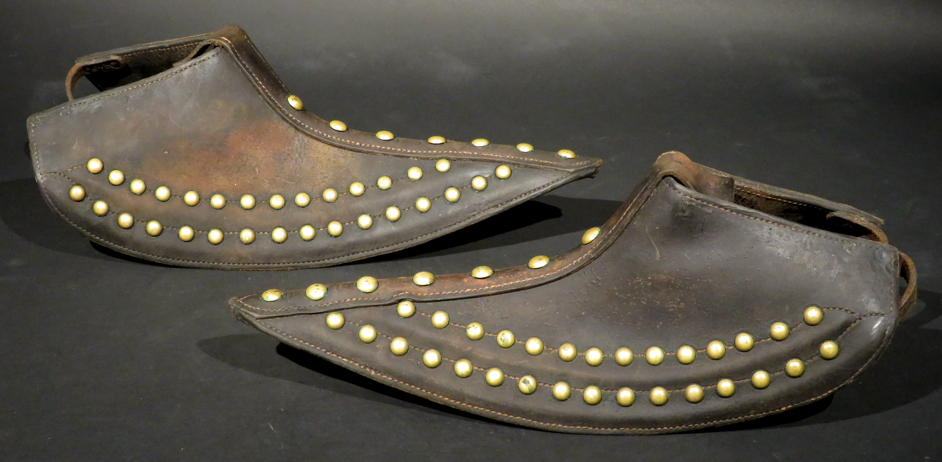 Pair of Brass Studded Leather Tapaderos, Western United States Circa 1930