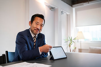 business-man-working-ipad-side-view.jpg