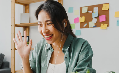 asia-businesswoman-using-laptop-talk-colleagues-about-plan-video-call-while-smart-working-