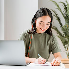 woman-with-headset-having-video-call-laptop.jpg