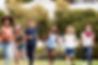 Happy, Successful, Well-Adjusted Youth Playing Together in a Park.