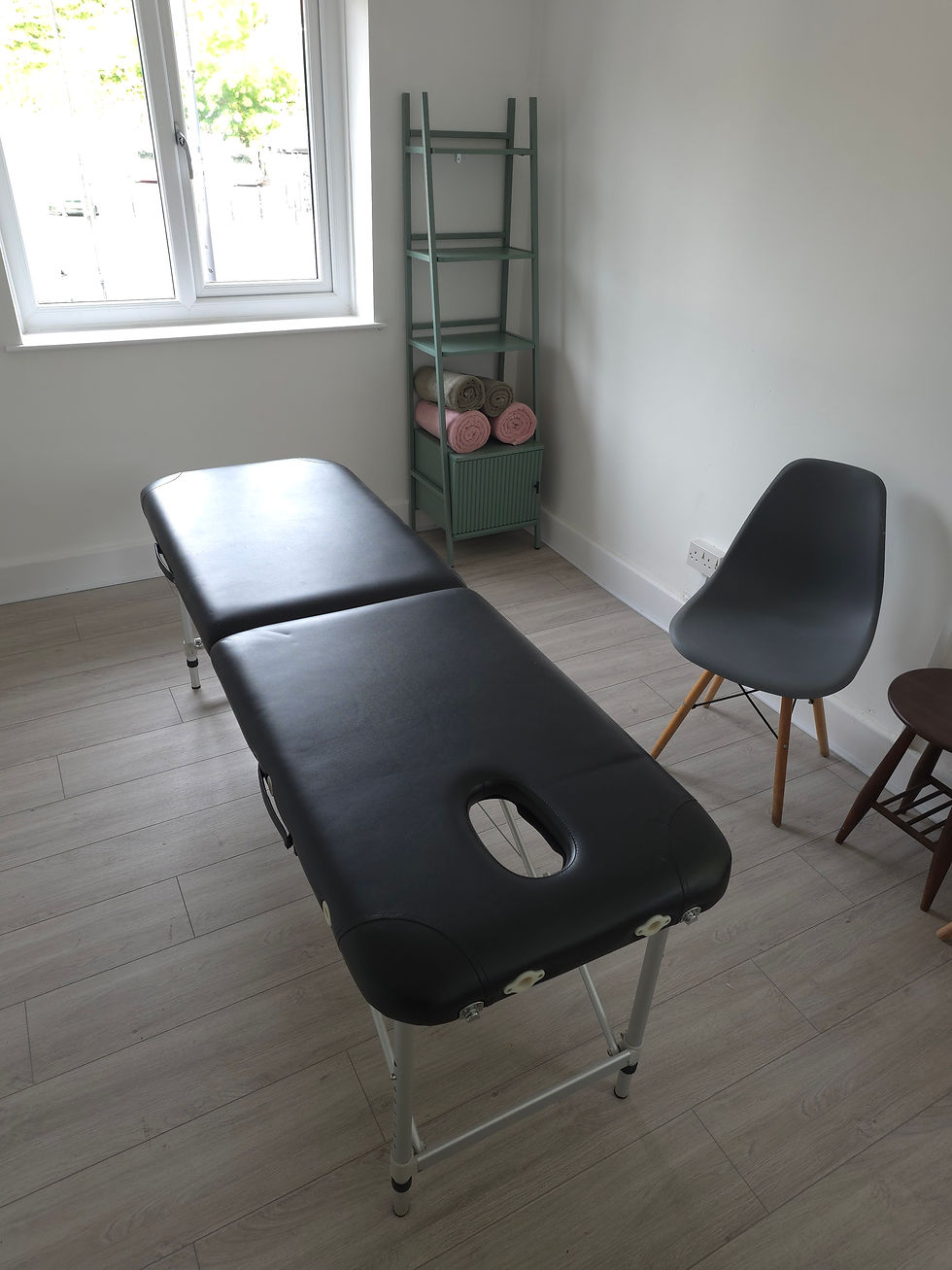 Treatment couch and client seating in the Treatment Room at Duffs Clubhouse