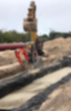 Septic Tank Prep and a big excavator moving a smaller excavator