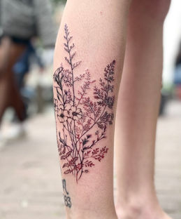 Delicate realistic, fineline bouquet of wild flowers tattoo.