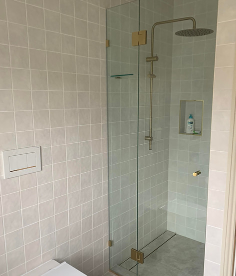 sammut glass-framless shower with bronze gold accessories