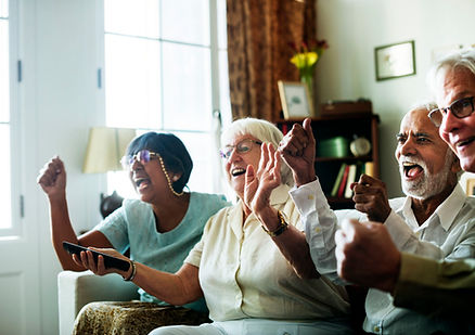 senior-people-watching-televison-together-scaled.jpg