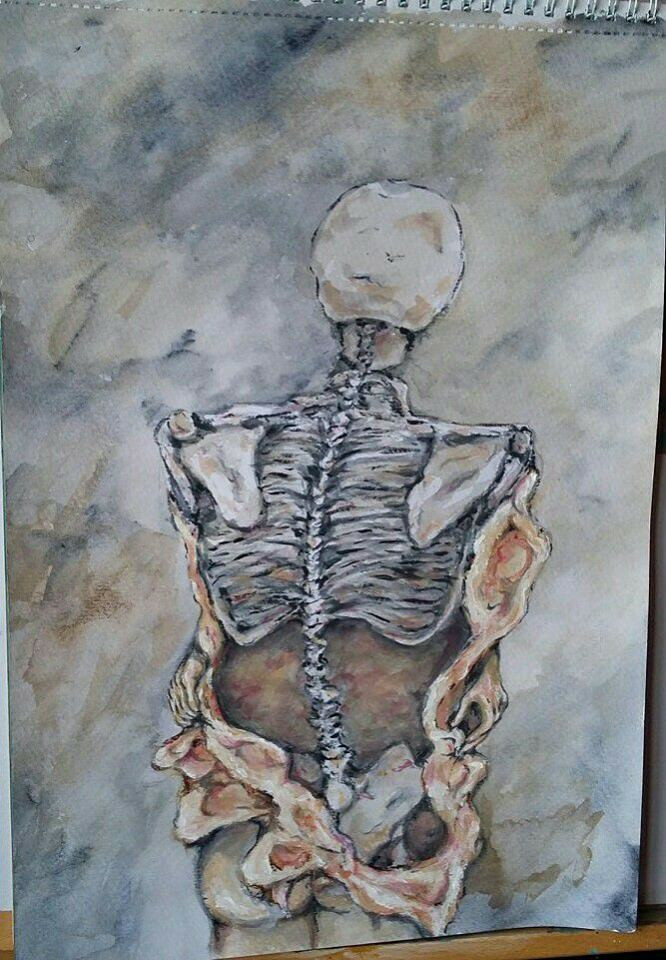 Back of a skeletal body suffering from bulimia, with exposed ribs and spine