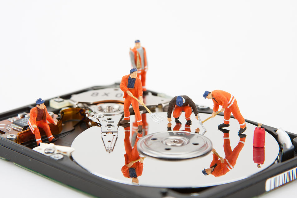 it-support-workers-repairing-hard-disk-drive.jpg