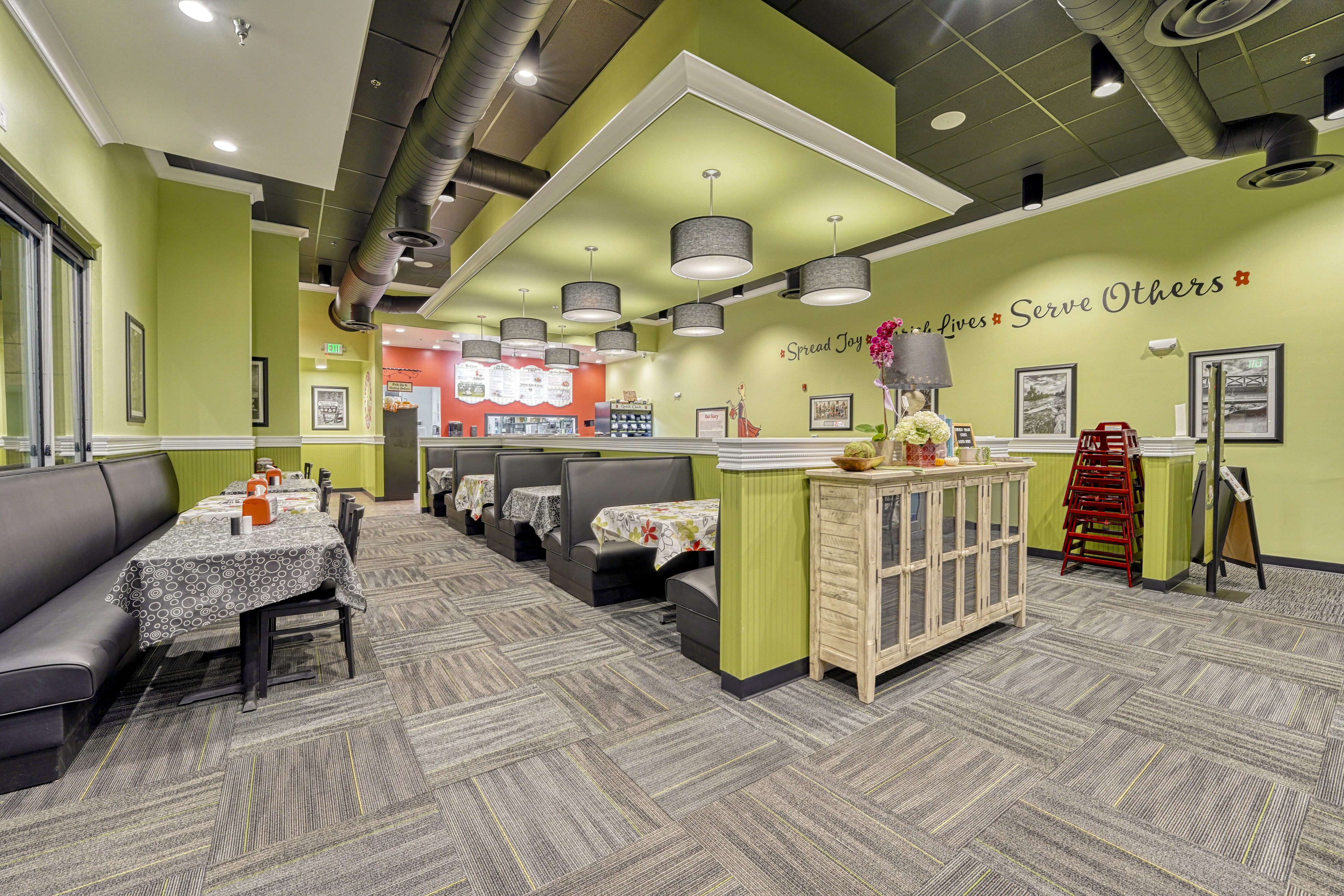 Chicken Salad Chick Aspen Grove dining area with pendant lighting and finished seating