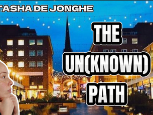 Woman with a thoughtful expression. Background: lit city street; string lights. Text: "NATASHA DE JONGHE," "THE UN(KNOWN) PATH."