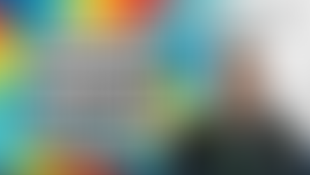 A smiling man with a vibrant background of a colourful pattern and a futuristic city in white. Text reads "Arber Ismaili, Embracing Neurodiversity Within the Career Search, 19th July 4PM".