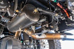 AIRIQ onboard air management compressor system installed underneath a custom Ford F-350 bu