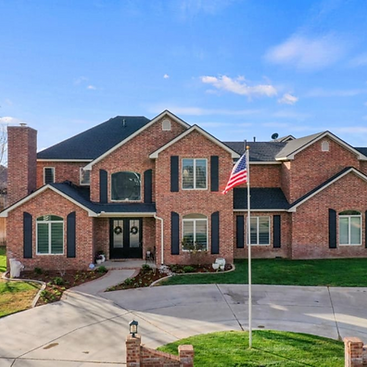 Exquisite luxury estate in Llano Estates, Lubbock, TX—featuring 4 beds, 5 baths, a 5-car garage, indoor racquetball court, basement, media/game room, and a heated saltwater pool with an outdoor kitchen. Nestled on a private 1-acre lot. Listed by Top Lubbock and West Texas Realtor, Lainie Eilenberger of Key & Slate Real Estate Group.