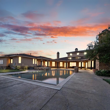 Exquisite 7-bedroom, 7-bathroom custom-built estate on a private 16-acre gated compound in Lubbock, TX, listed by top Lubbock and West Texas real estate agent Lainie Eilenberger. This 10,000 sq ft home features 26ft ceilings, top-of-the-line Wolff appliances, a commercial pizza oven, and a fireplace in the breakfast nook. The master suite includes an in-ground jacuzzi, his/hers closets, and an advanced Kohler shower. The property offers a downstairs theater, outdoor living area, screened-in patio, saltwater pool, two hot tubs, a private chapel, two large barns, and solar panels. Contact Lainie Eilenberger for more details.