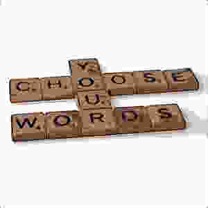 Comic cartoon of scrabble blocks that say Choose Your Words