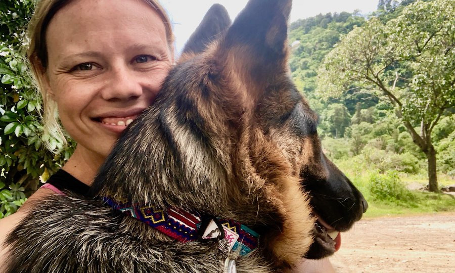Girl and German Shepherd wearing handmade macrame friendship bracelet collar