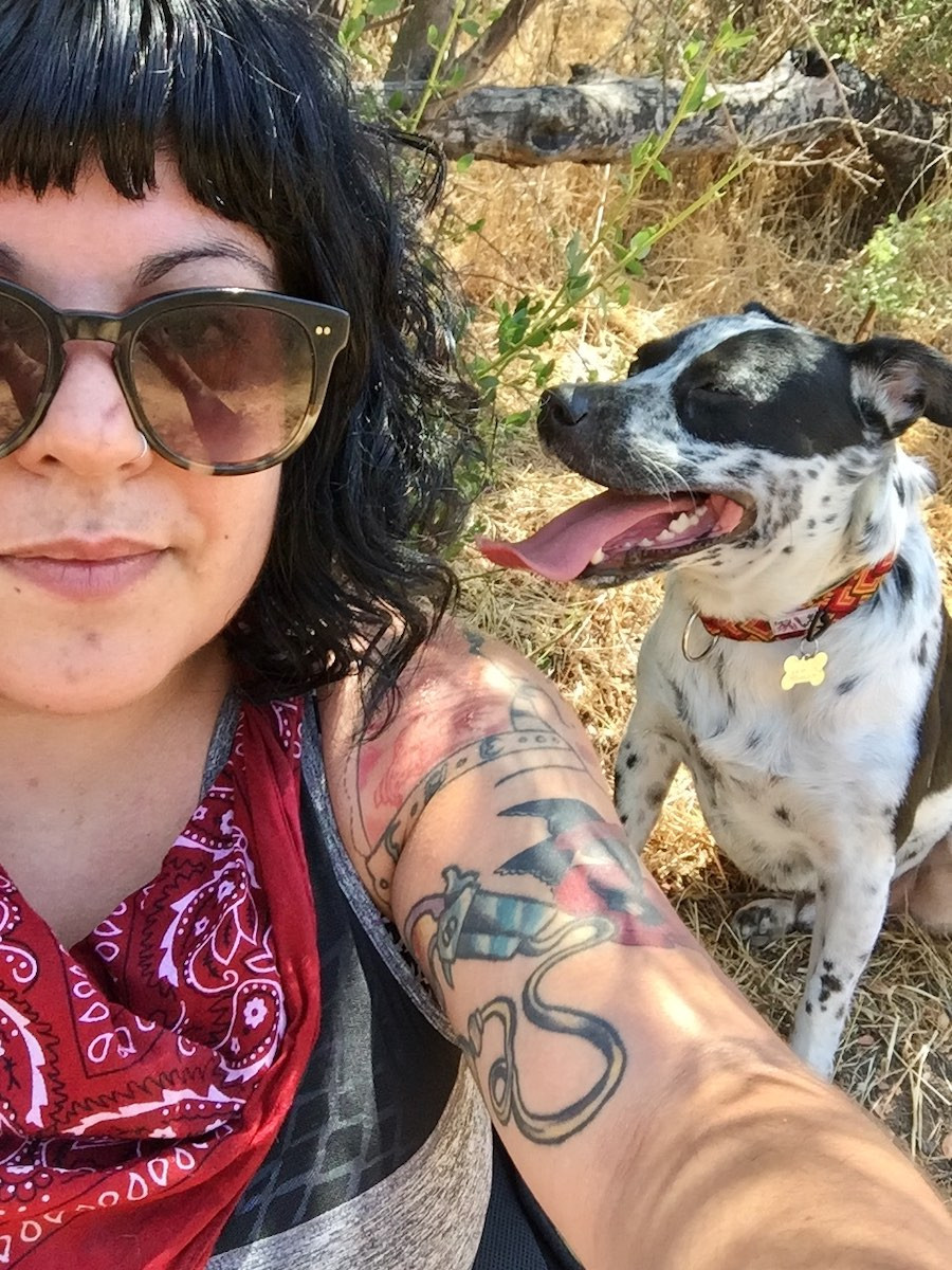 dog wears handmade collar and hipster girl