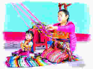 indigenous Guatemalan artisan weaves dog apparel