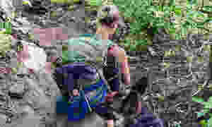 Hiker with German Shepherd and handmade paracord dog leash