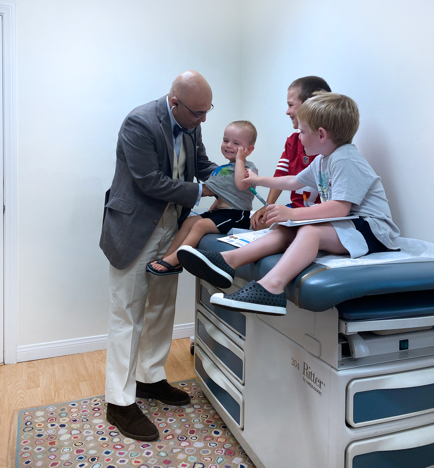 Dr. Mehrdad Mehr, concierge pediatrician in Santa Barbara CA, with young patients