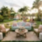 A festive outdoor party setup with a light blue sofa, rattan chairs, and floral decorations on a lush lawn. Guests mingle in the background during a golden hour sunset.