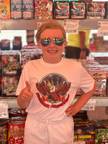 Iron Eagle Fireworks in Kingdom City and Fulton, MO - girl giving thumbs up in fireworks tent