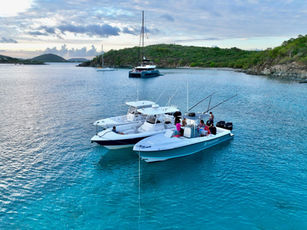 Fishing boats anchored during a beautiful sunset.