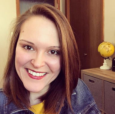 Photo of Angela Hoffman smiling in an office.