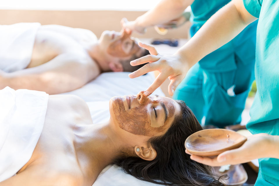 couple spending a day at the spa getting facials