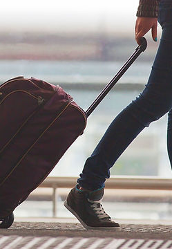 Person%20Rolling%20Suitcase%20in%20Airpo