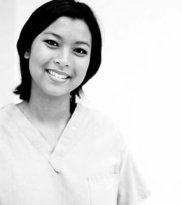 Smiling woman in scrubs