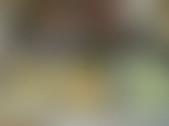 Hand selecting diced fruits and vegetables from glass containers on a checkered cloth, with a plate of rice nearby. Fresh and colorful.