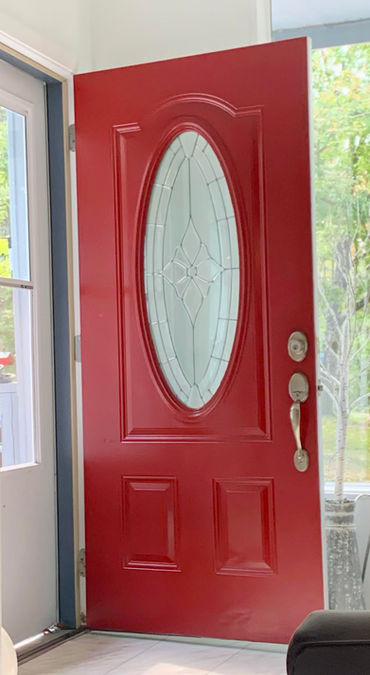 Front door before faux wood finish application.