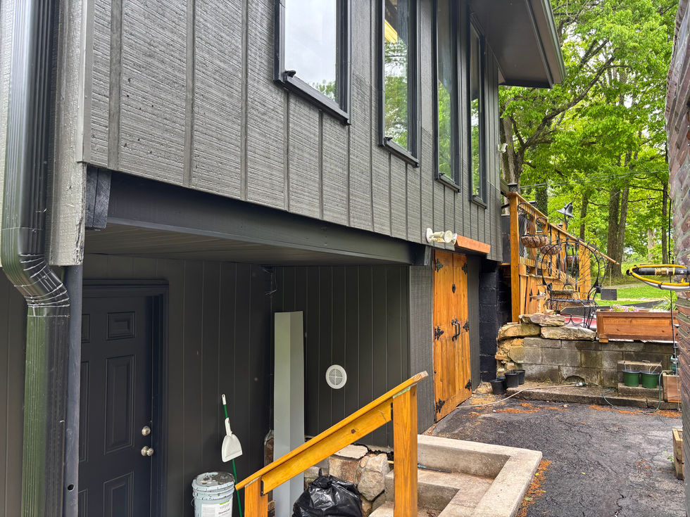Rear view of home after exterior repaint and before installation of wood accents.