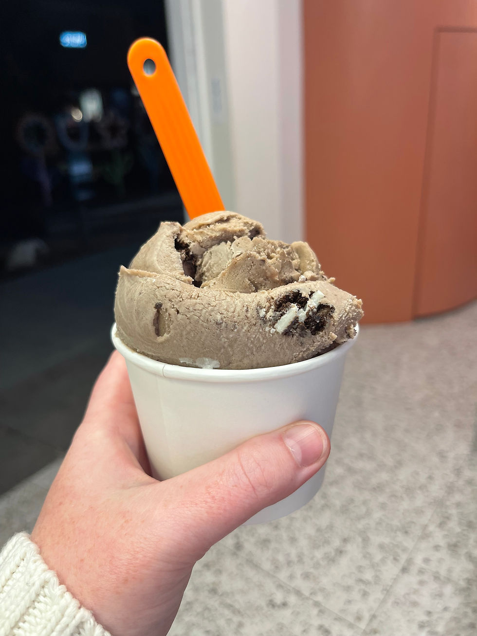 High angle view of a scoop of ice cream in a bowl