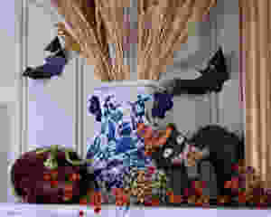 I enjoy decorating with older, gathered pieces that have a memory or some sort of meaning attached. I love this black cat. It was the first Halloween decoration I bought when I was a newlywed 27 years ago. The cat's face reminds me of my husband's (Mr. O) face when he learned that we would be decorating for Halloween!