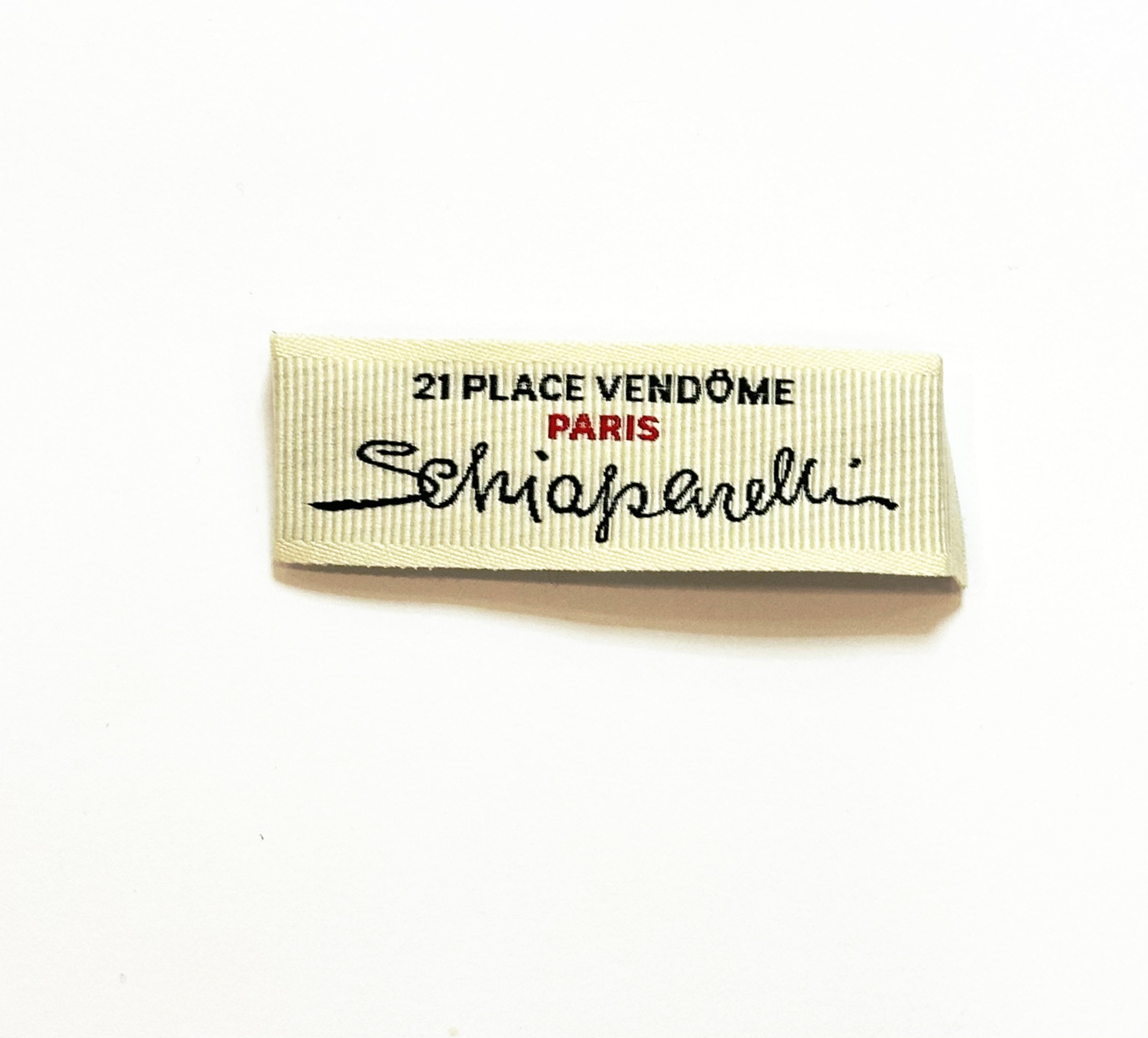 Лейба 5.7*2см колір світлий беж логотип Schiaparelli