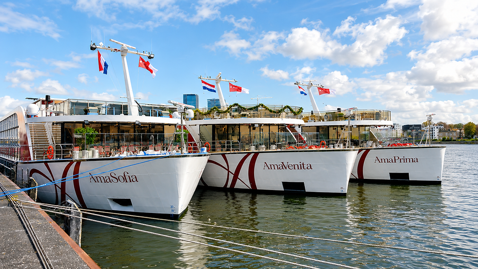 Three AmaWaterways river cruise ships docked side by side in Amsterdam