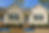 A beige house before & after pressure washing services were done.