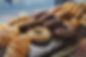 Tray of various kind of bagel such as chocolate, mixed grain or plain bagel, crossaint in