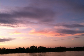 Sun setting over Fish River signifying our ties to the community.