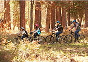 Two adults and two children ride bikes through Blakely Forest in Spanish Fort.
