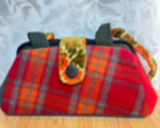 red, orange and grey beezer bag