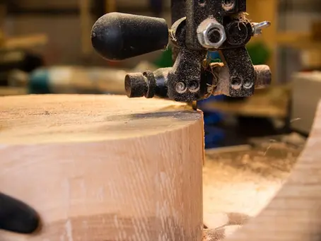 cutting an ash bowl blank on a Jet bandsaw