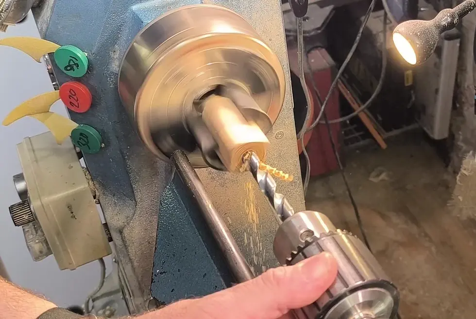 Drilling a wooden pen blank on the lathe using a long drill bit