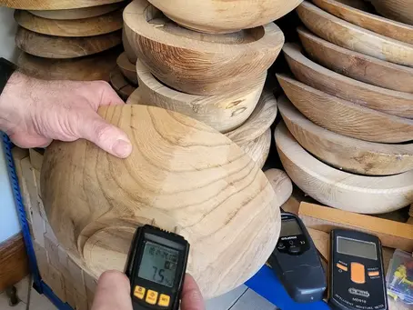 testing a twice turned bowl for moisture content using a pin style moisture meter