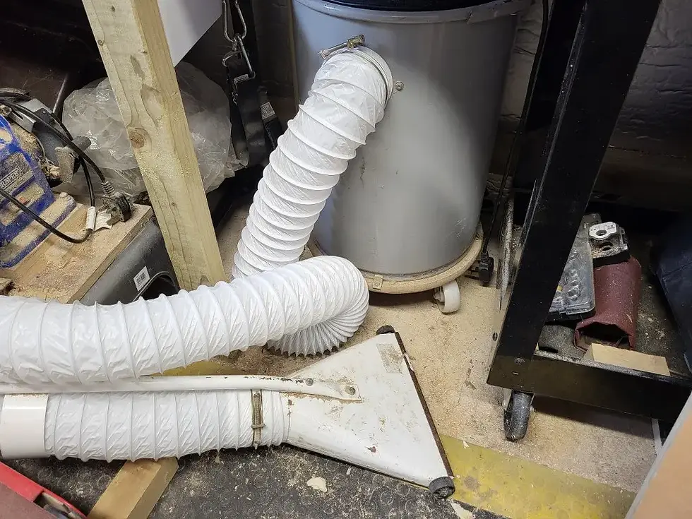 drum dust extractor on wheels with flexible ducting hose for improved mobility in workshop