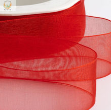 Organza woven edge ribbon available in four sizes and thirty-one stunning colors for elegant decorating and crafting.
